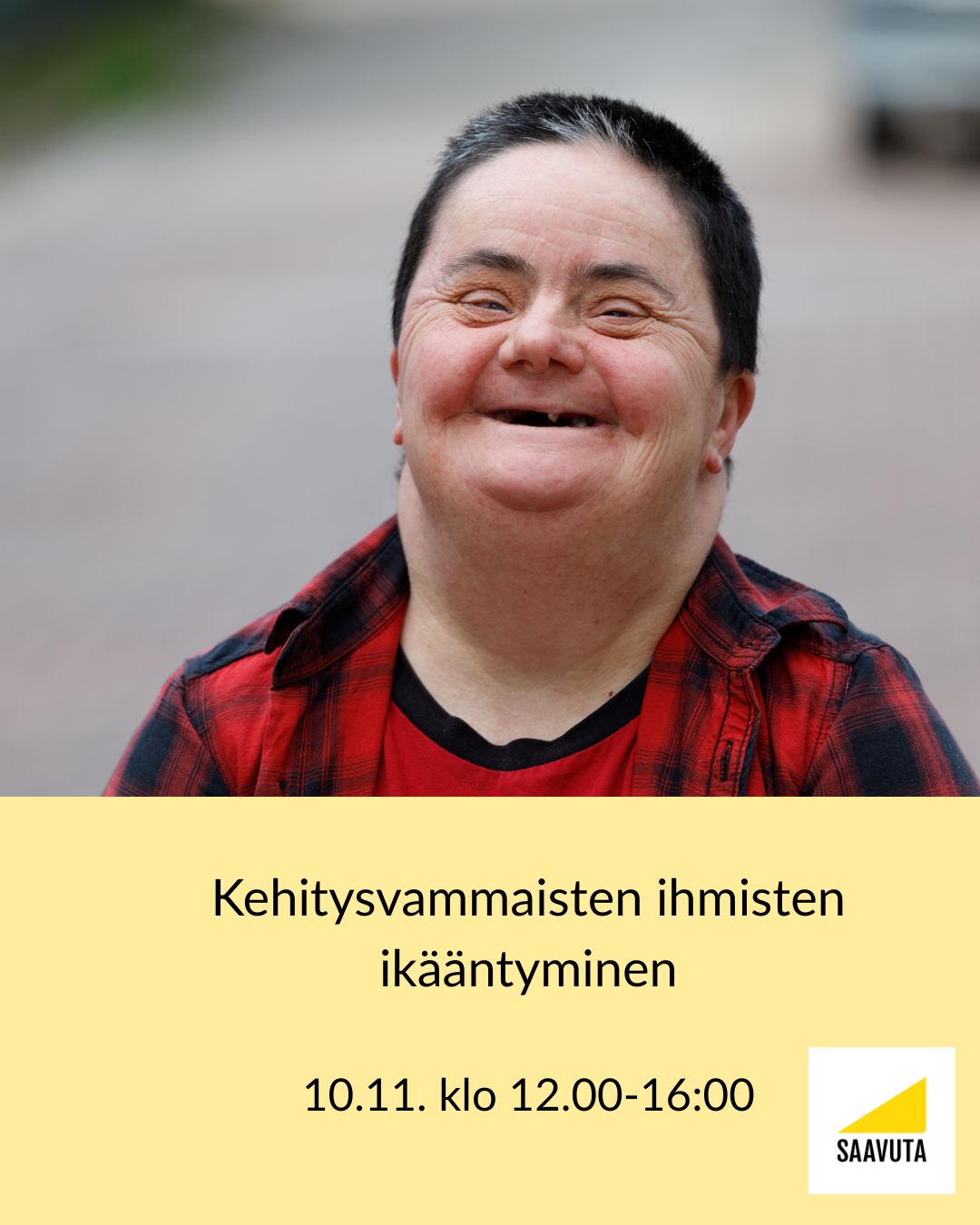 nainen punaisessa puserossa nauraa.